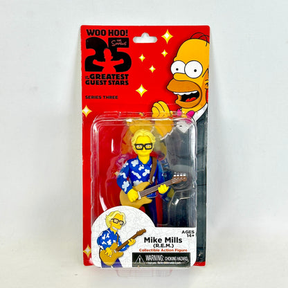 Action figure packaging featuring a character with glasses and a guitar, on a white background.