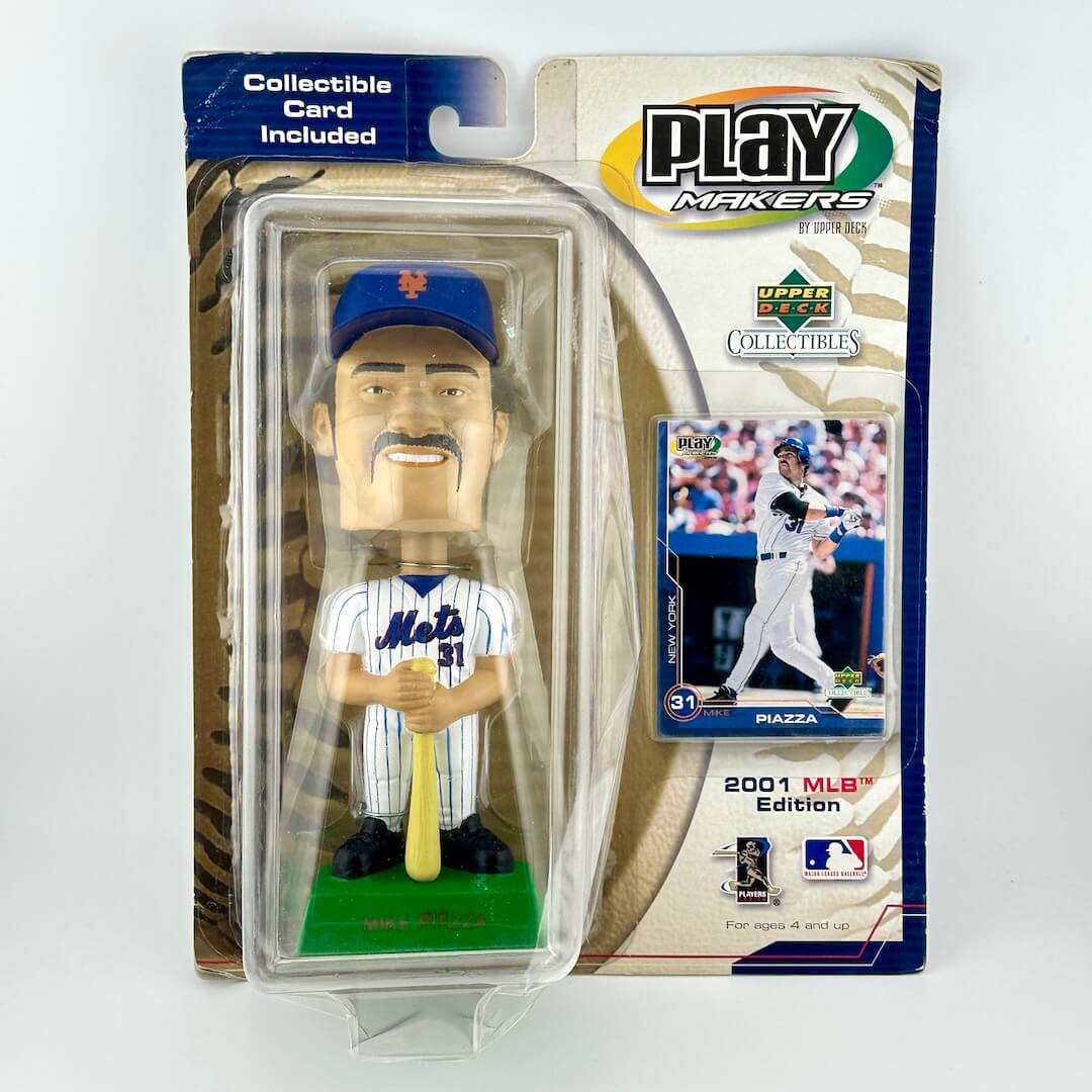 Baseball bobblehead figure in packaging with a collectible card, featuring the New York Mets uniform.
