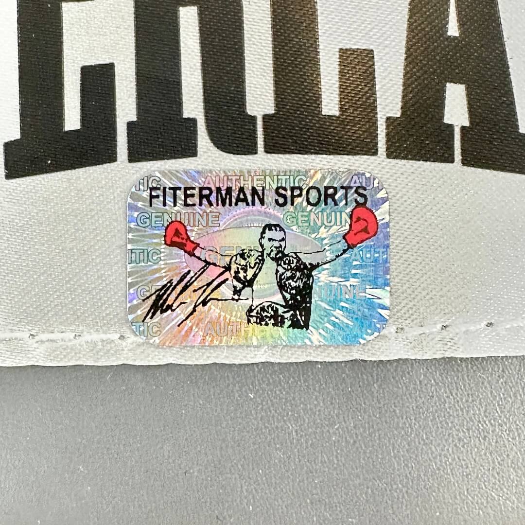 Sticker with 'Fiterman Sports' text on a gray background