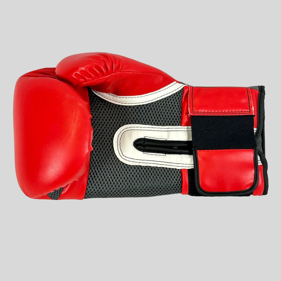 Red boxing glove with black and white accents on a light gray background