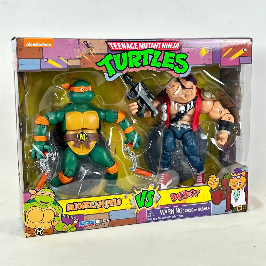 Teenage Mutant Ninja Turtles action figure set in retail packaging, featuring Michelangelo and Bebop.