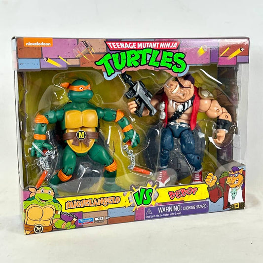 Teenage Mutant Ninja Turtles action figure set in retail packaging, featuring Michelangelo and Bebop.