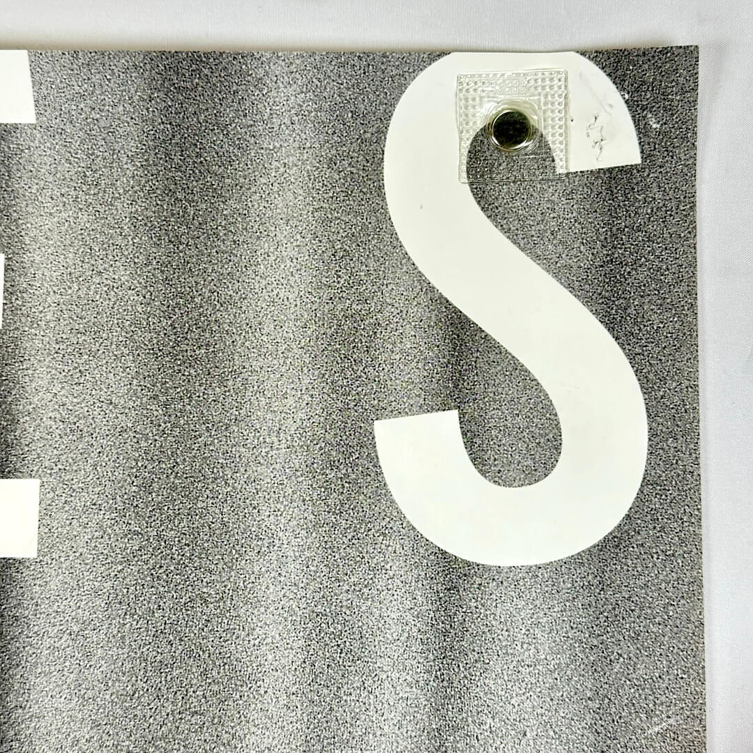 Top right corner with pin holes.