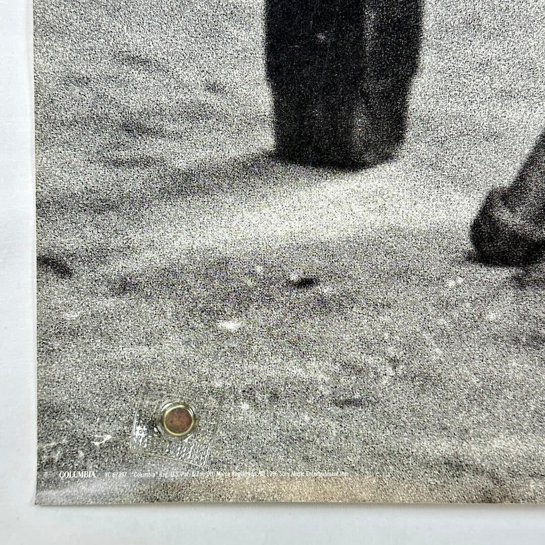 Bottom left corner with pin holes. 