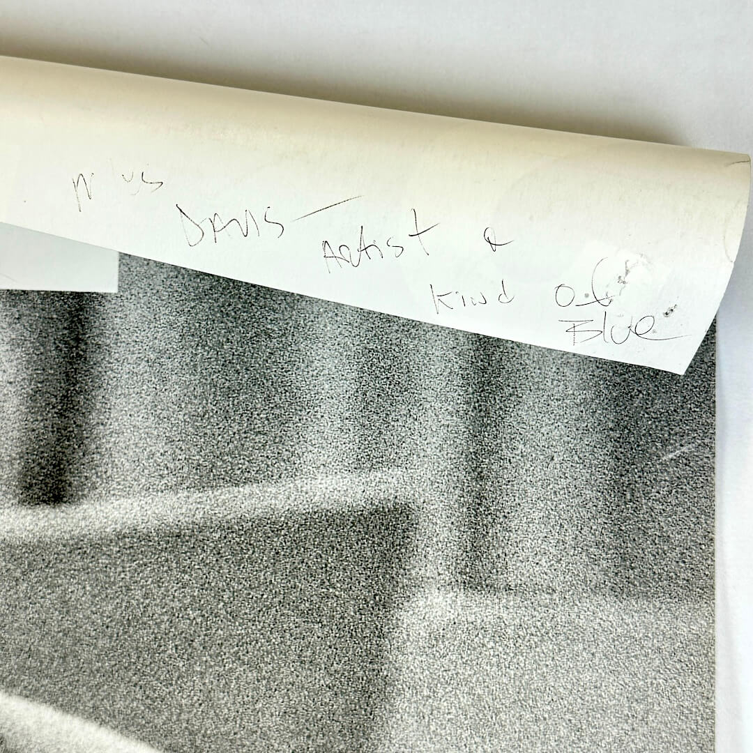 Top right corner rolled down to show pen note on backside. 