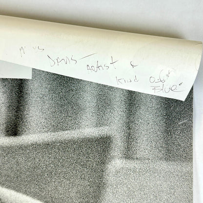 Top right corner rolled down to show pen note on backside. 