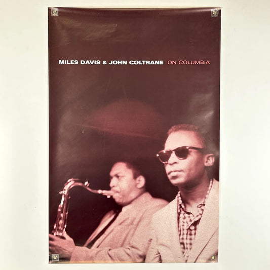 Poster of Miles Davis and John Coltrane with text 'Miles Davis & John Coltrane on Columbia' on a plain background.