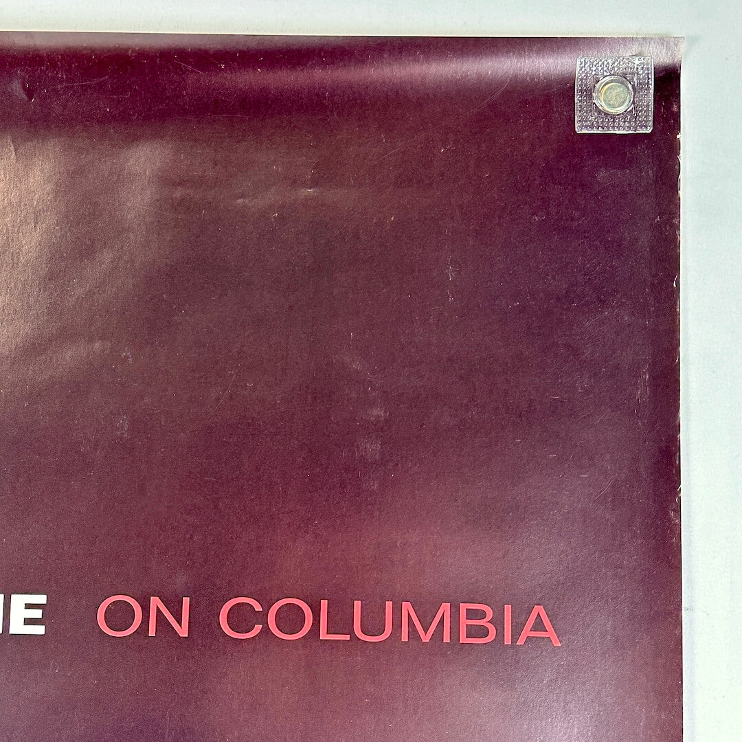Top right corner of poster with light edge wear. 