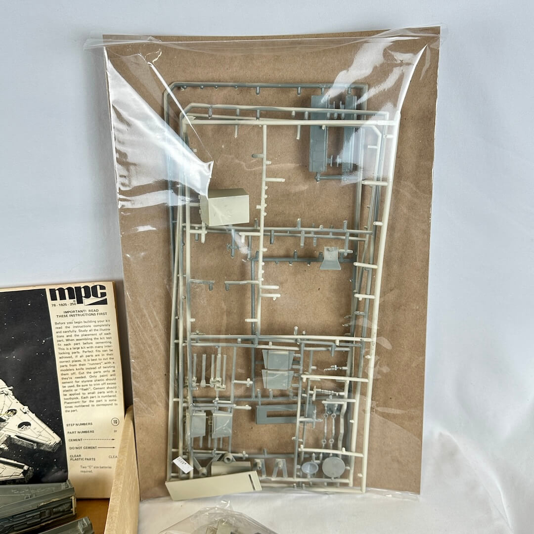 Model kit packaging with metal parts on a cardboard backing, featuring the MPC brand.