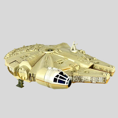 Millennium Falcon toy against white background