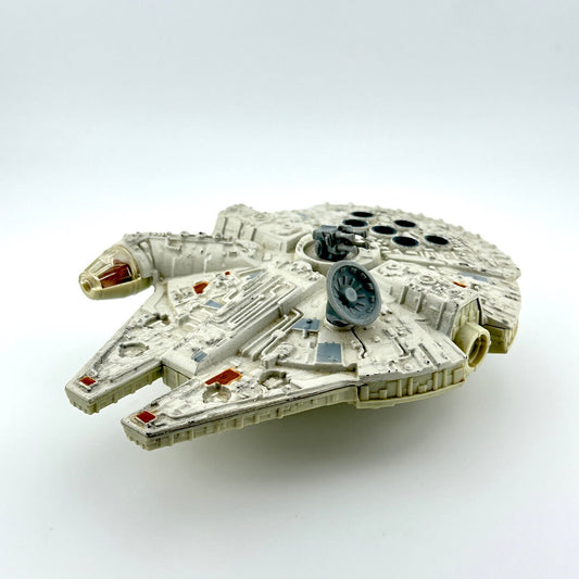 Diecast model of a spaceship of the Millennium Falcon on a white background