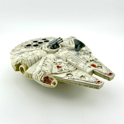 Diecast model of a spaceship of the Millennium Falcon on a white background