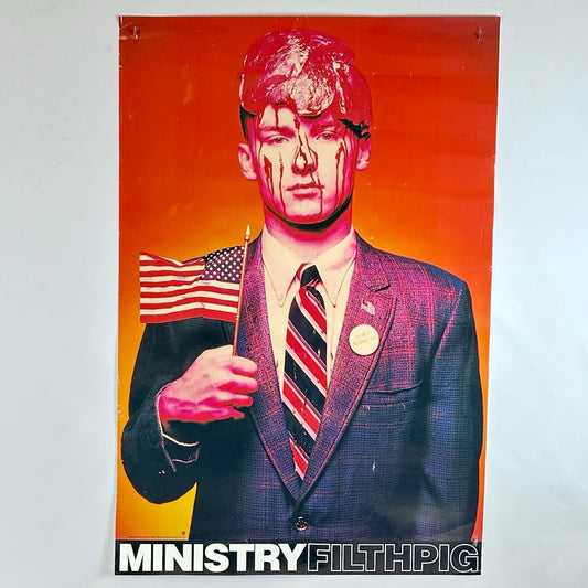 Artistic depiction of a person in a suit with an American flag, against a red and orange background, with 'Ministry Filthpig' text.