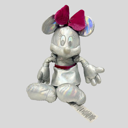 Silver plush toy with pink bow on a white background