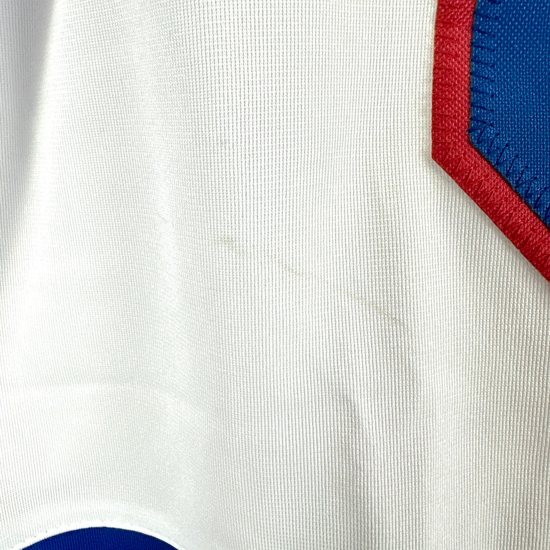 Close-up of a white fabric with red and blue accents