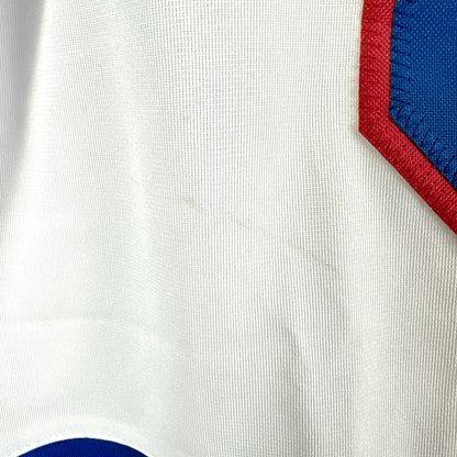 Close-up of a white fabric with red and blue accents