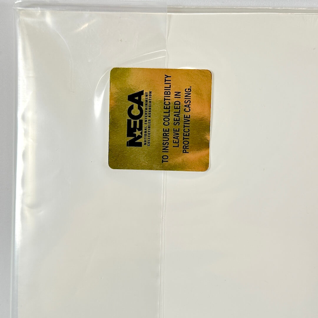 Clear protective casing with a gold label featuring NECA branding on a white background