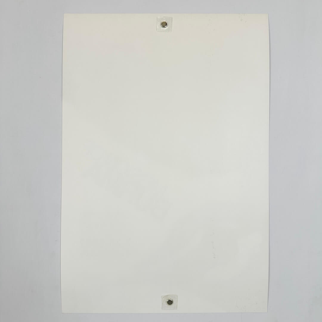 Backside of white poster in pristine condition against white background.