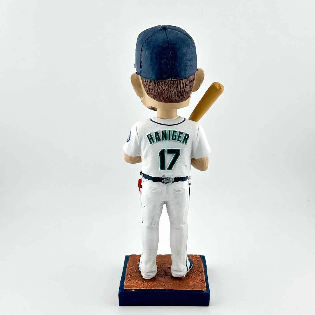Baseball bobblehead figure with a uniform and bat on a white background