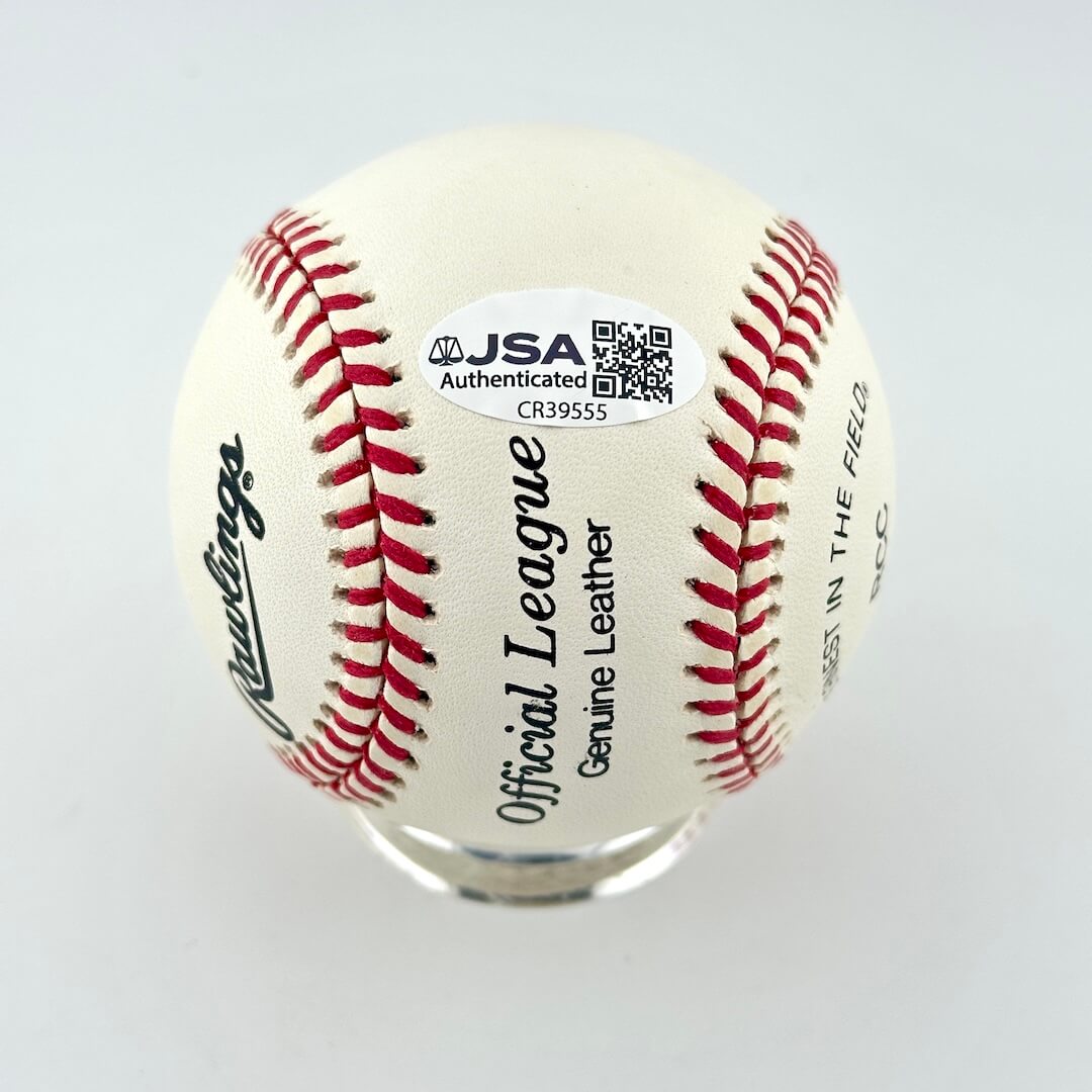 A Rawlings Official League baseball  featuring red stitching, a white leather surface, and a JSA Authentication sticker.
