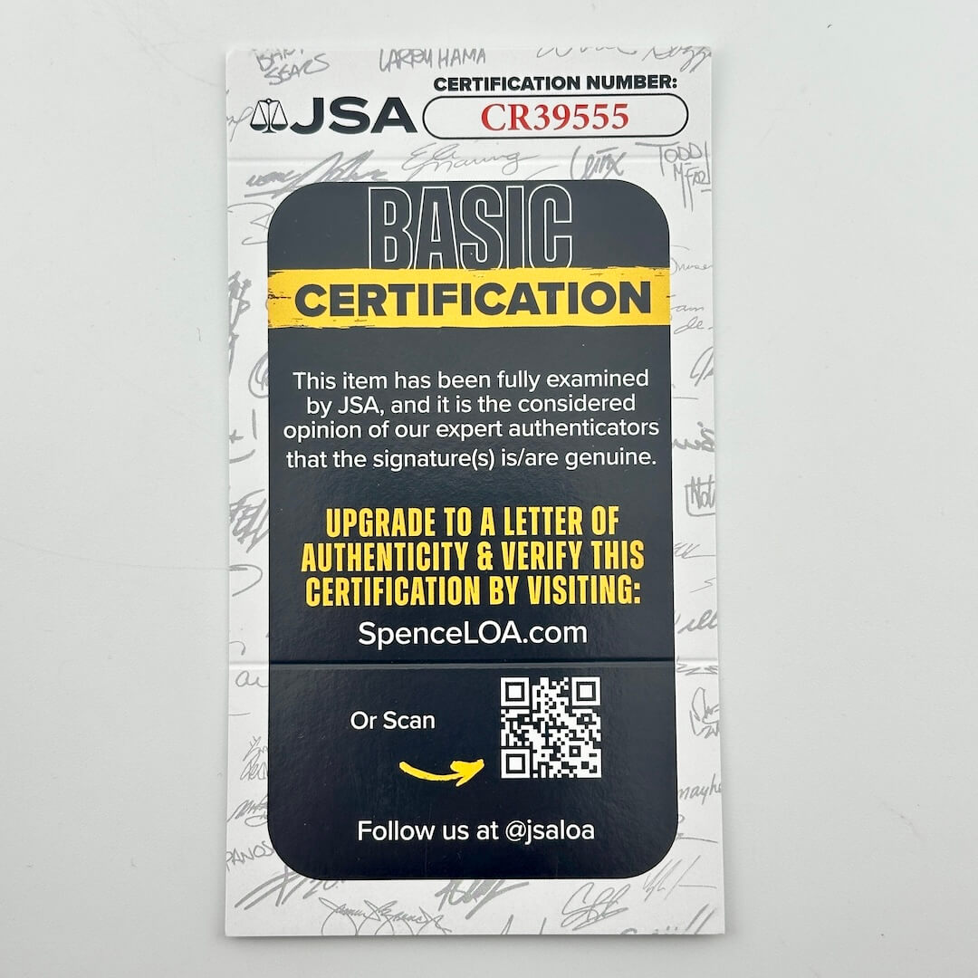 A JSA Basic Certification card with a black and yellow design, featuring text about authenticity verification and a QR code.