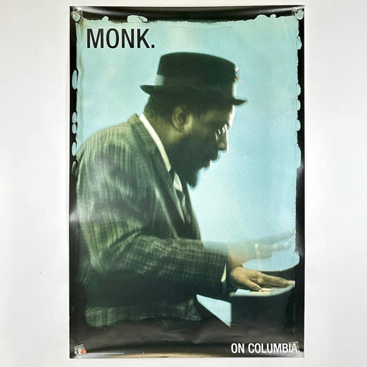 Poster of a man in a suit and hat with 'MONK.' and 'ON COLUMBIA' text.