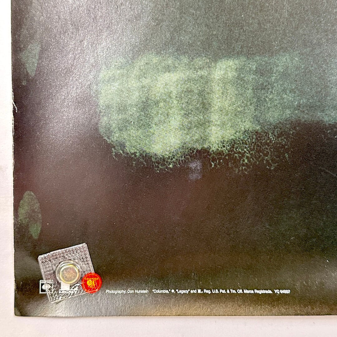 Bottom left corner with copyright information and creased corner. 