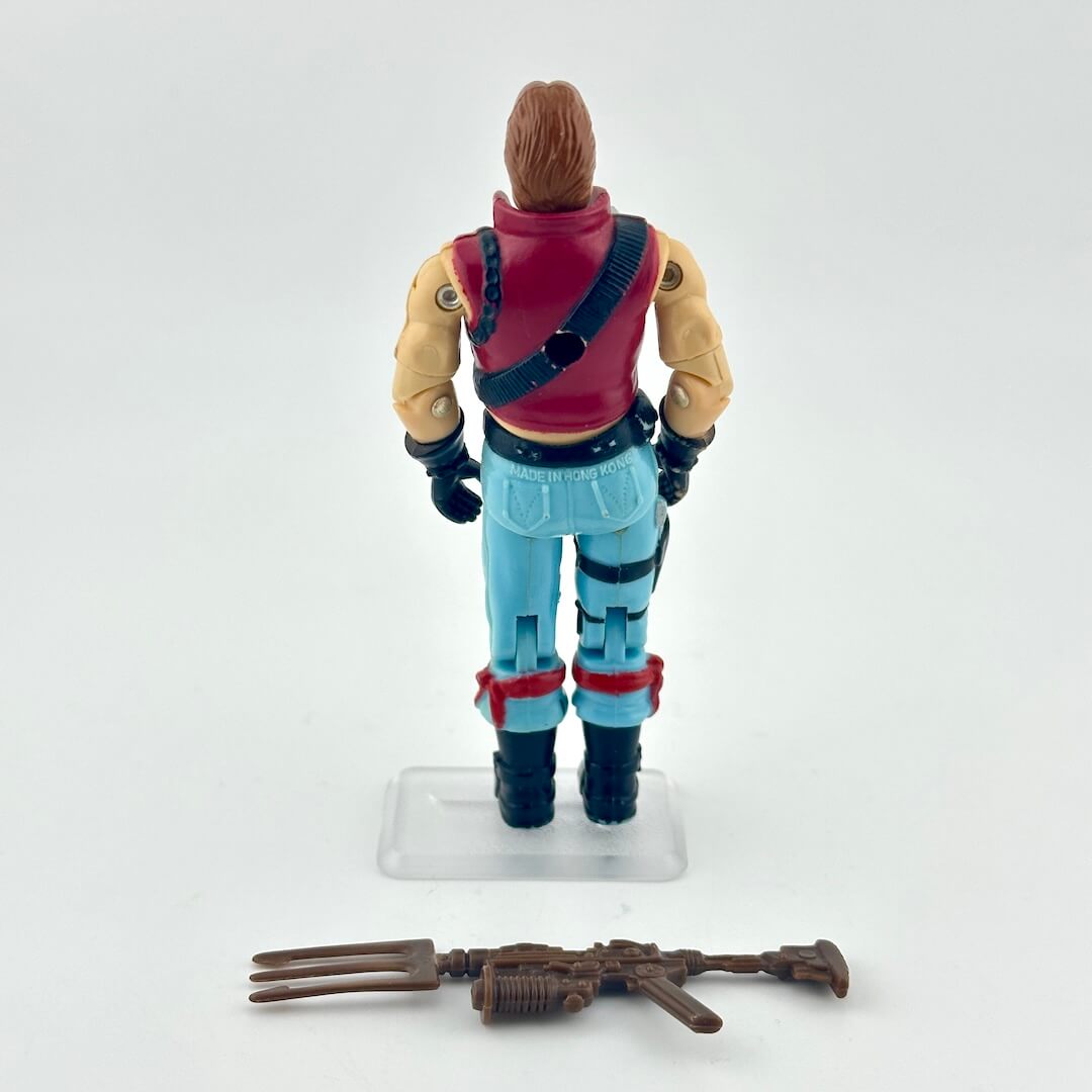 Action figure with a red jacket and blue pants on a white background