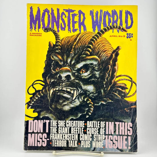 Vintage April 1965 issue of Monster World Magazine, featuring a detailed illustration of a horned monster on a yellow cover. 