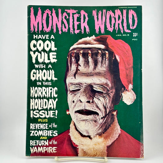 Vintage January 1965 issue of Monster World featuring a cover of Frankenstein's monster in a Santa hat on a green background.