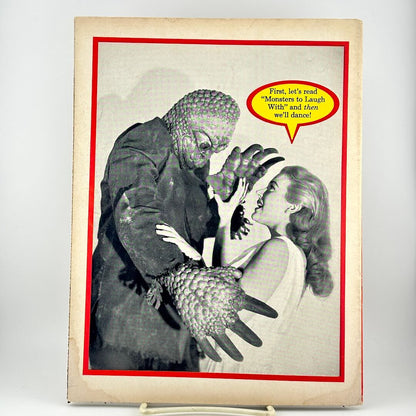 Back cover of magazine with image of monster attacking woman with speech bubble above her head surrounded by red border.