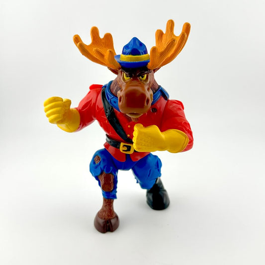 Toy figure of a moose in a red jacket and blue pants on a white background