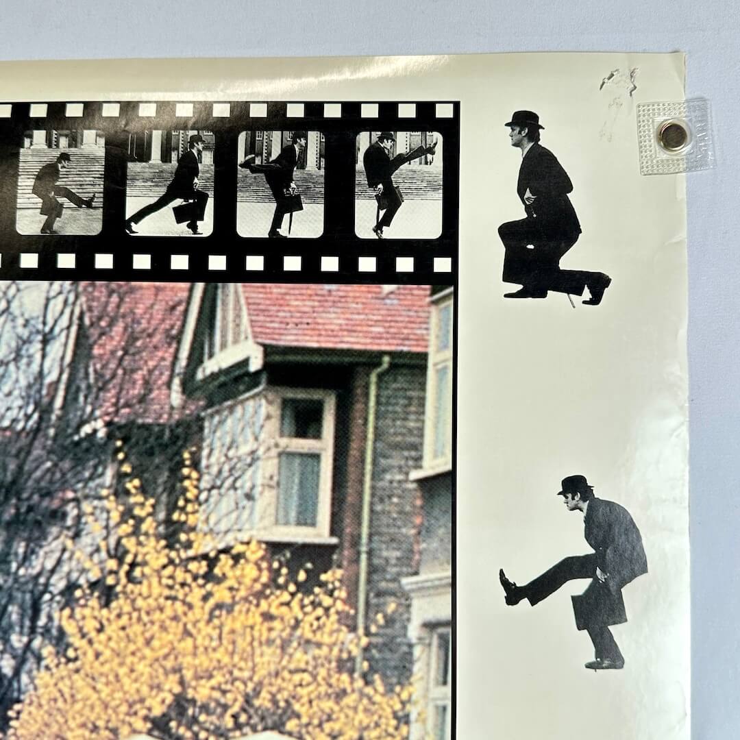 Top right corner of poster with pin holes and minor edge wear