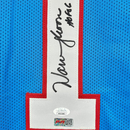 Close-up of a sports jersey with a signature and brand logo on a blue background