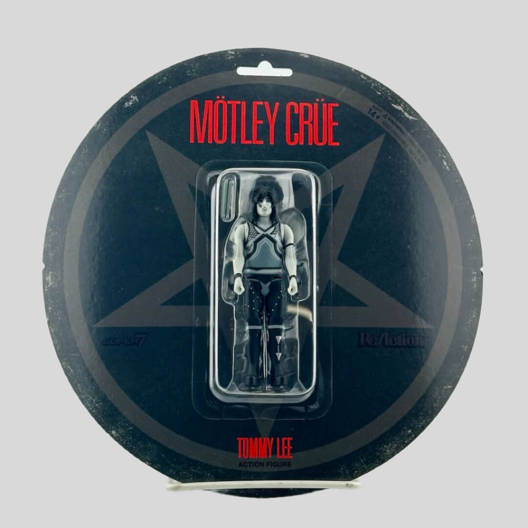 Black circular package with black/white action figure of Tommy Lee in  plastic blister.