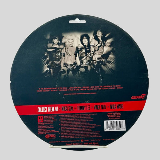 Black circular package with red, white, & black text for product & manufacturer information. 
