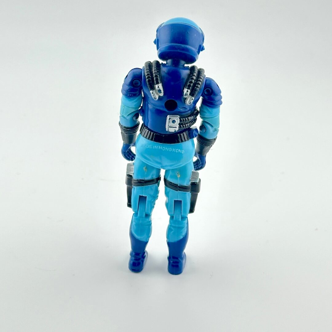 GI Joe action figure in blue flight suit against white background.
