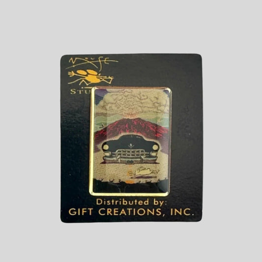 Hard enamel pin of black cadillac driving away from exploding volcano, nearly hitting a white rabbit in front.