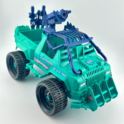 Toy truck with blue gun attachment on a white background