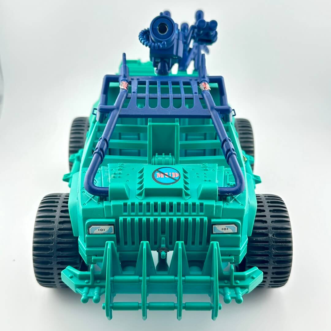 Toy vehicle with green body and blue accents on a white background