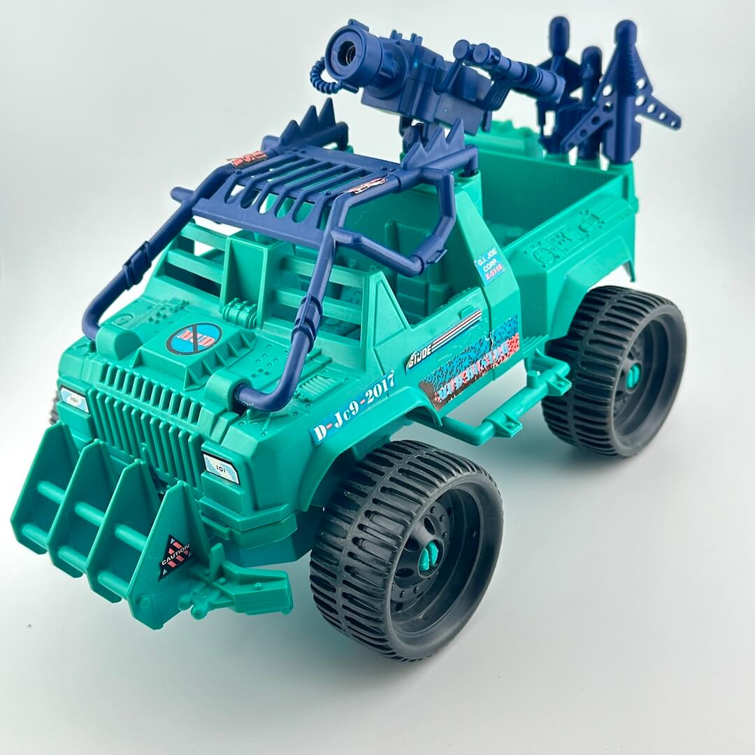 Toy truck with blue gun on a white background