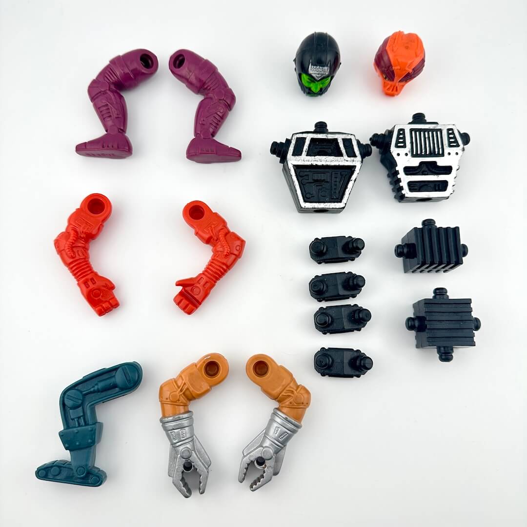 Set of toy figure parts on a white background