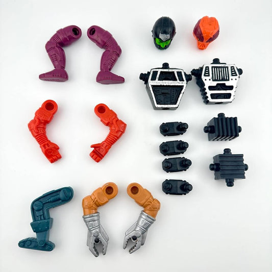 Set of toy figure parts on a white background