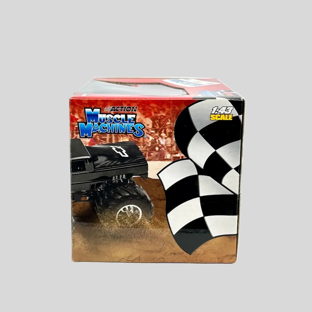 Box of Muscle Machines toy truck with checkered flag design on a white background