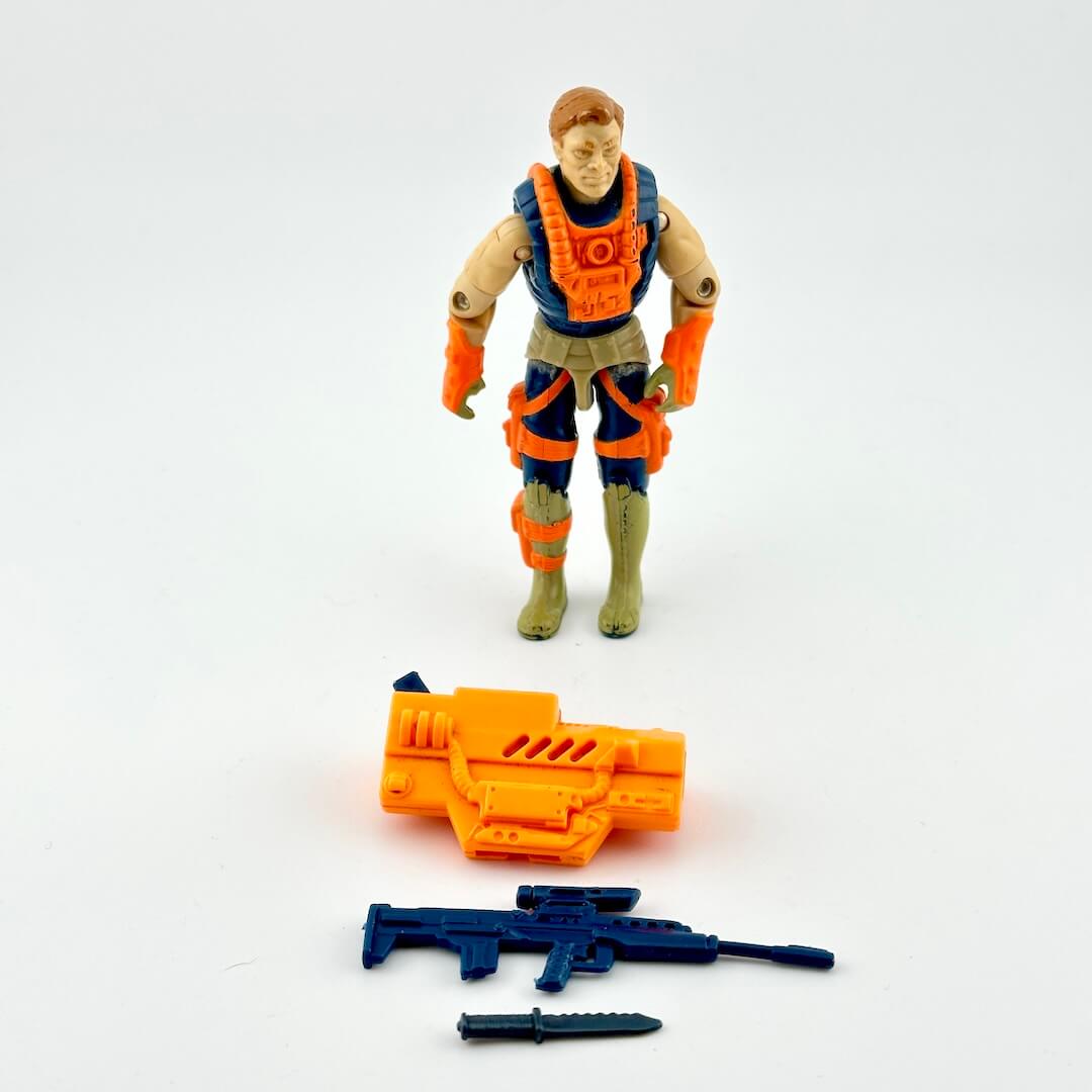 GI Joe action figure in orange and navy blue with accessories on white background. 