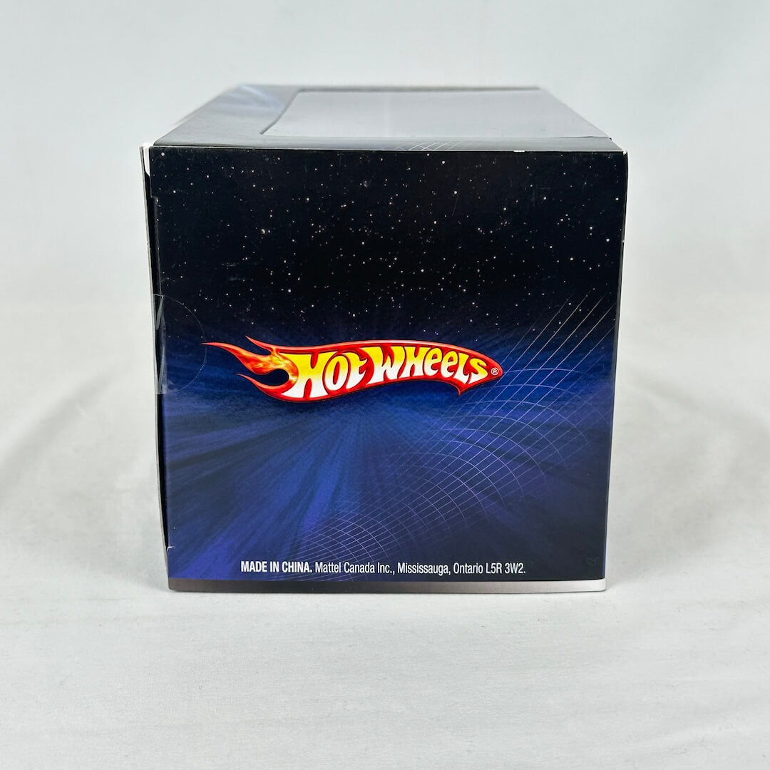 Hot Wheels packaging with a blue background and red and yellow logo.