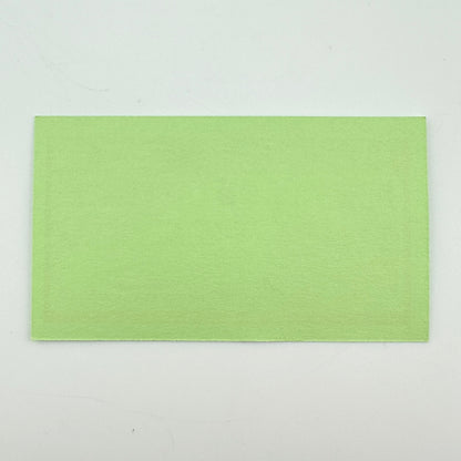 Backside of green rectangular pass with no graphics or damage. 