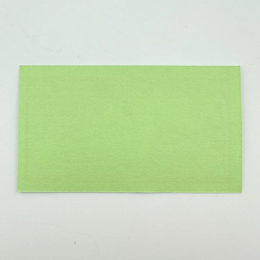 Backside of green rectangular pass with no graphics or damage. 