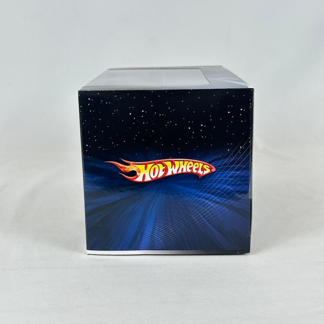 Side view of ship packaging featuring Hot Wheels branding on blue and black background. 