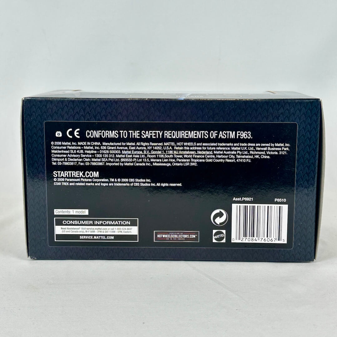 Back of a Star Trek toy box with branding and safety information on a white background